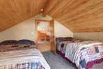 Couloir Cabin upstairs bedroom with two queen beds. 